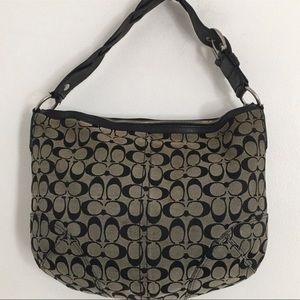 Coach signature print bag with one shoulder braided strap. M0782-11859.